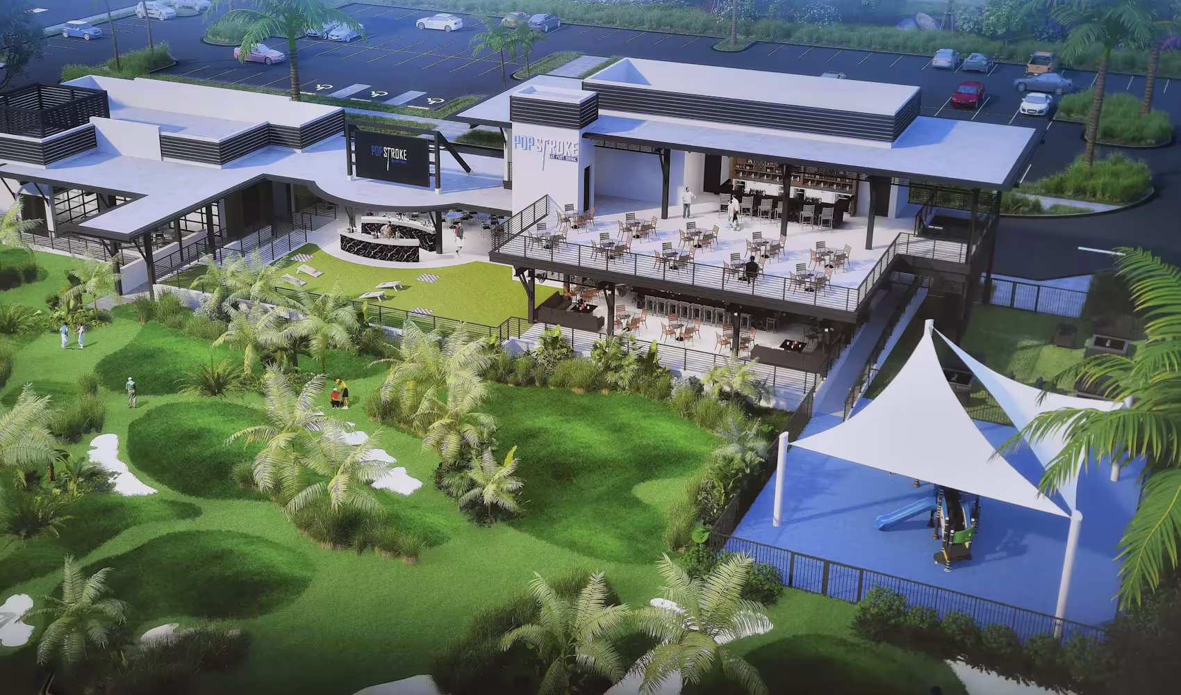 A drone shot of a well-manicured golf course surrounded by dining and entertainment facilities