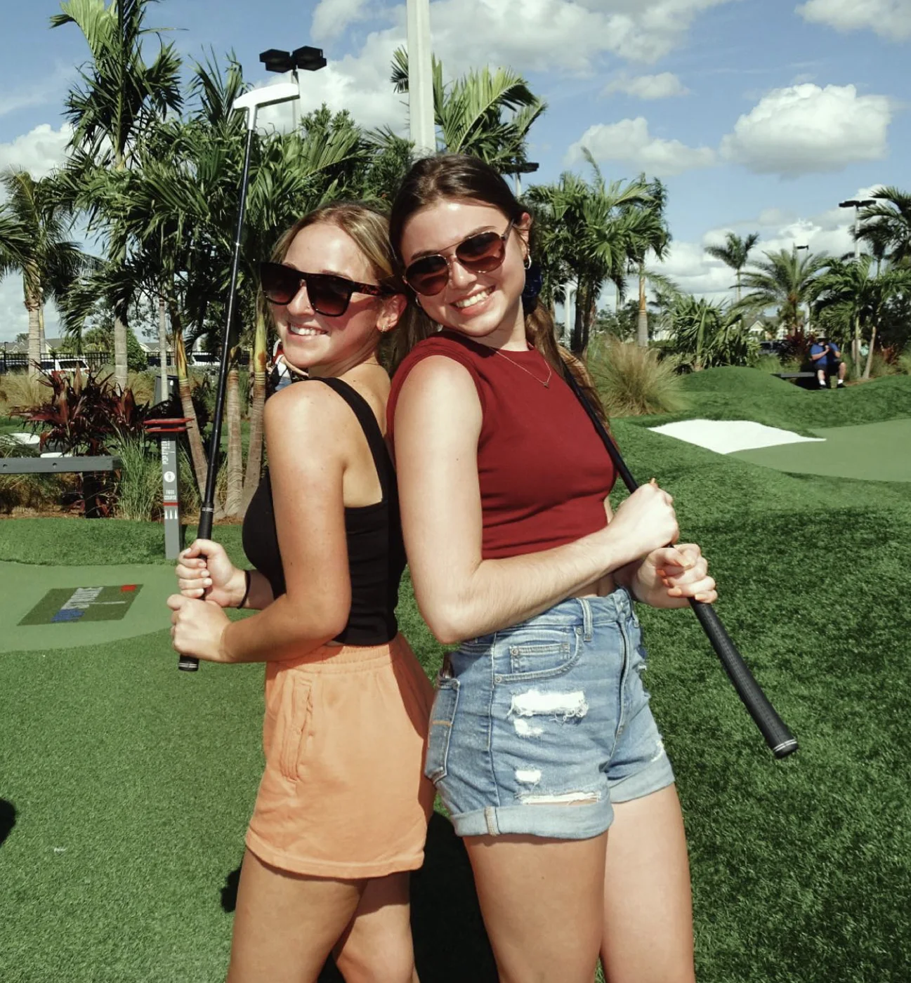 Friends enjoying a round of mini golf at PopStroke